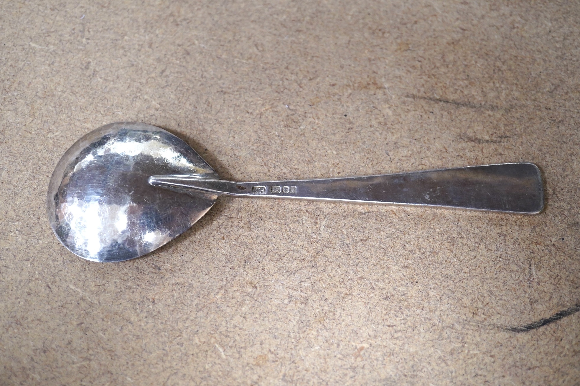 A modern Guild of Handicraft silver spoon, the terminal engraved with mythical beast, London, 1986, 16.7cm, 57 grams. Condition - fair